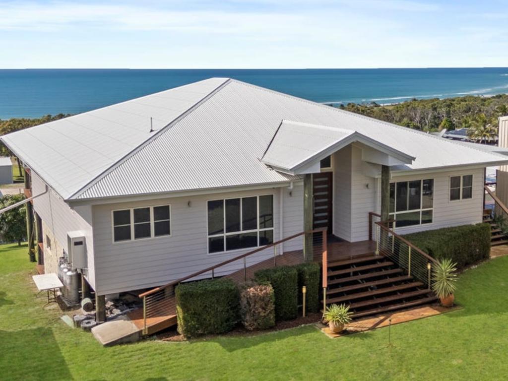 K’gari house smashes sale record as six bidders battle for island property