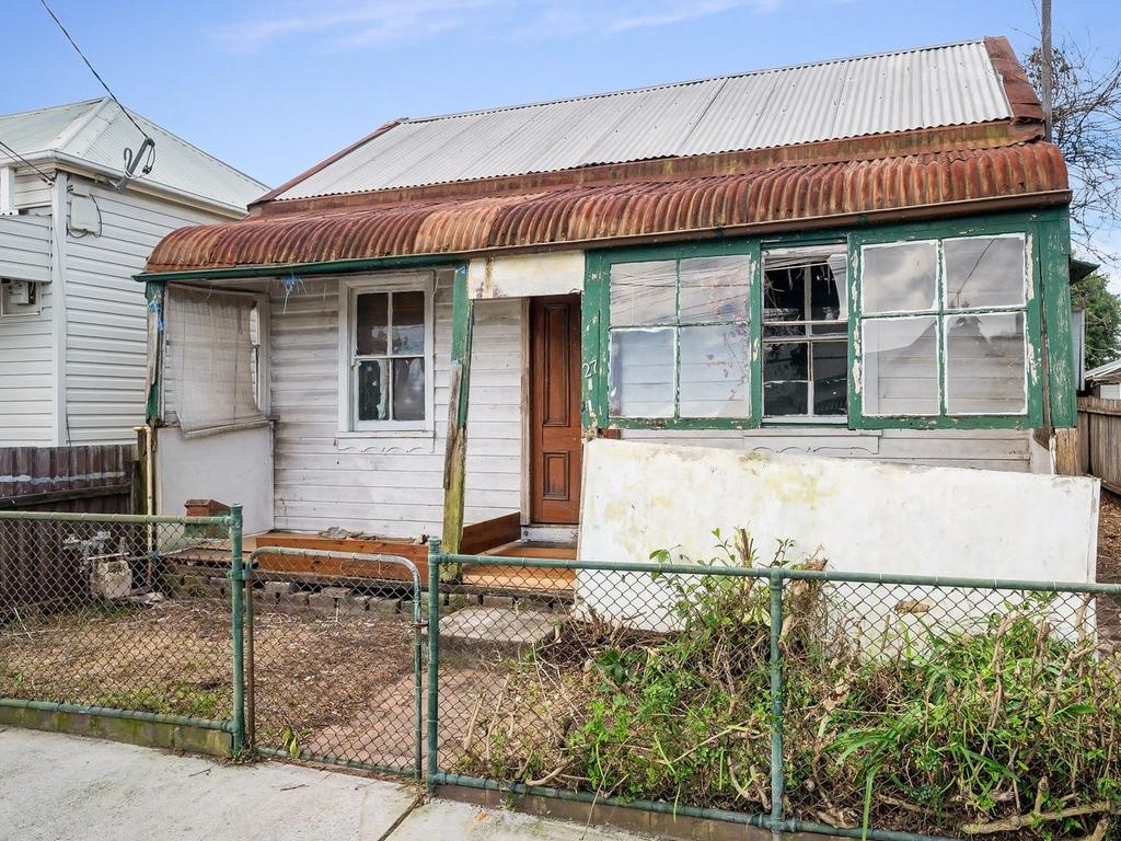 Derelict Sydney home with rotting floors sparks developer frenzy before auction