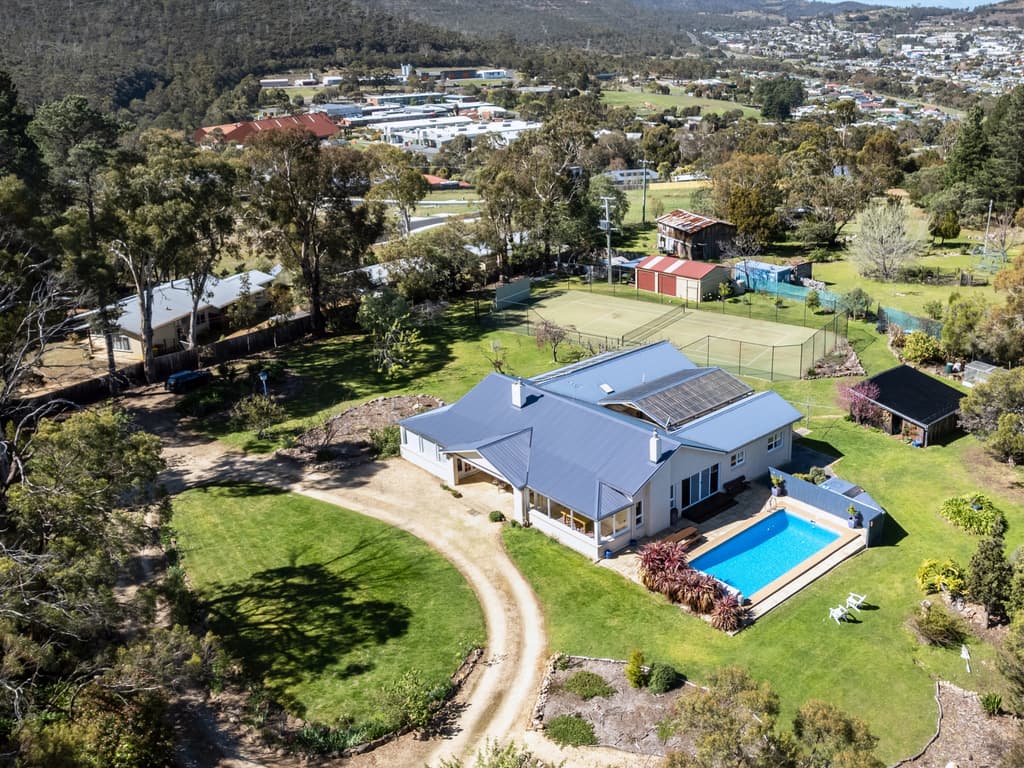 Dive in: Lindisfarne pool and tennis court home is No.1 listing
