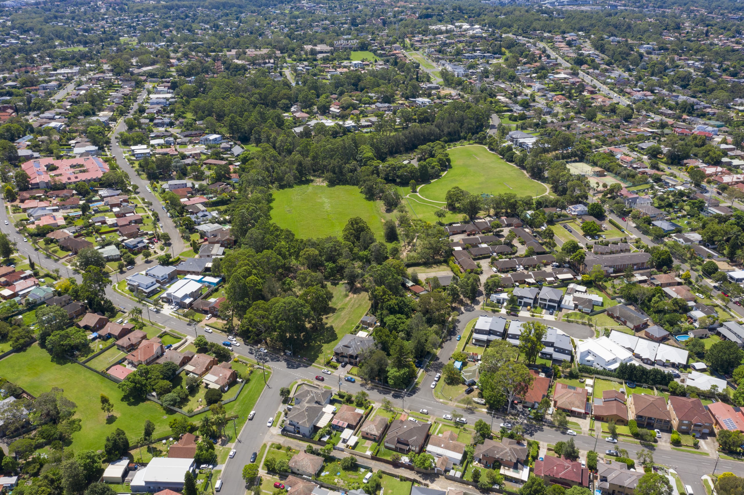 Aerial view of houses, streets and parks in the Sydney suburb of Ermington