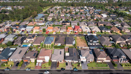Australians' wealth falls from record levels as home prices decline